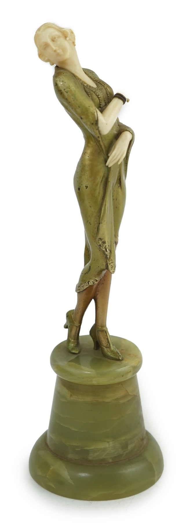 Attributed to Josef Lorenzl. An Art Deco bronze and ivory figure of a stylish lady